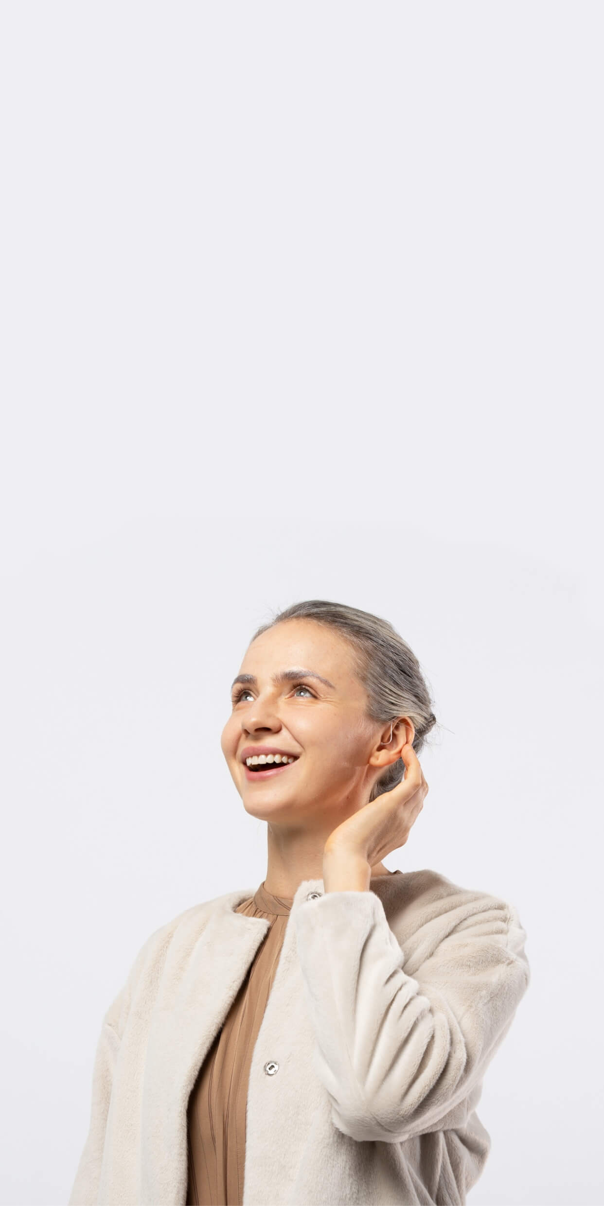 wearing Orka Hearing aids to receive better sound experience.